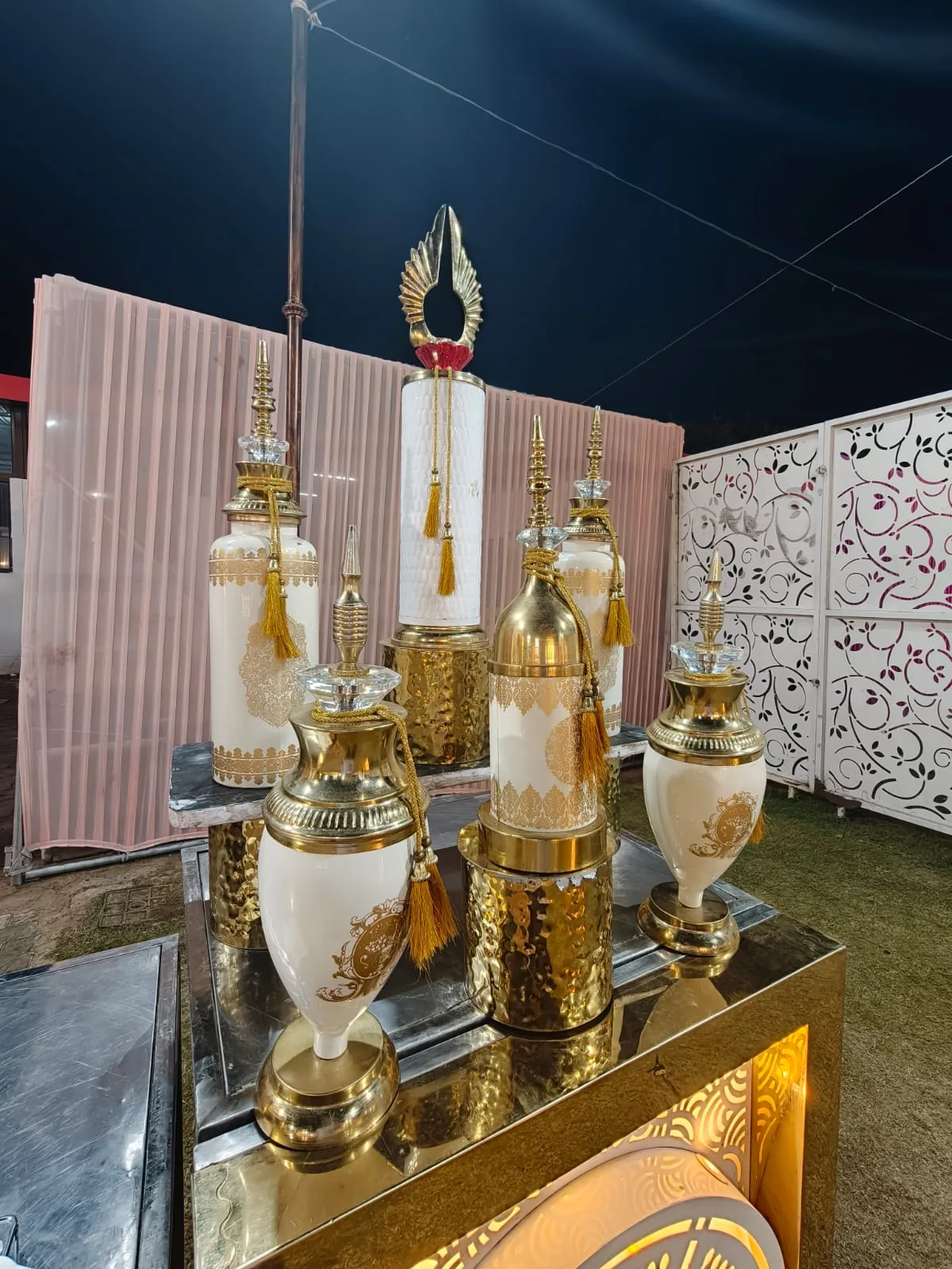 Ivory and gold decorative vessels for wedding catering