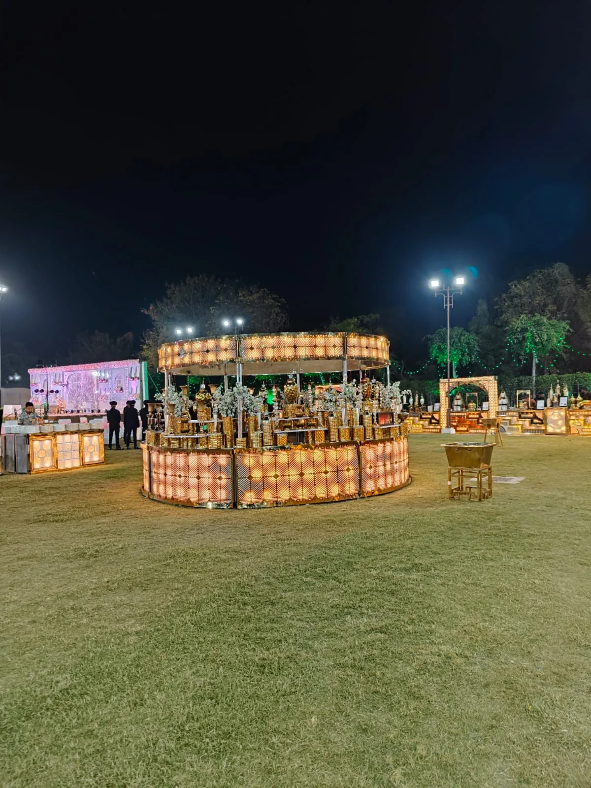 Close view of an illuminated Indian wedding food display