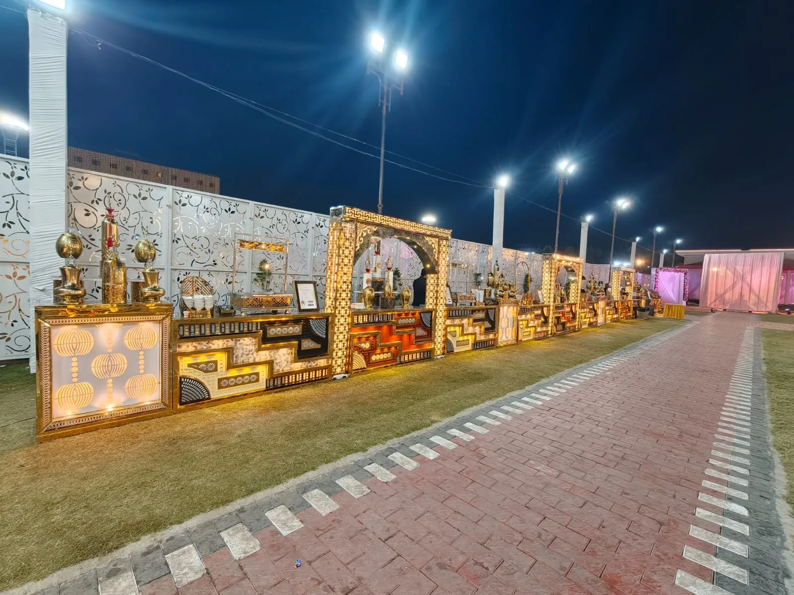 Grand wedding catering counters beside the event walkway