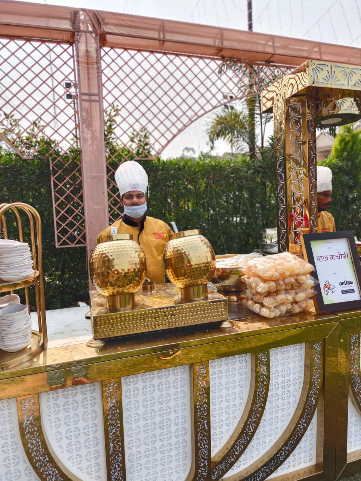 Raj kachori chaat station with uniformed catering staff