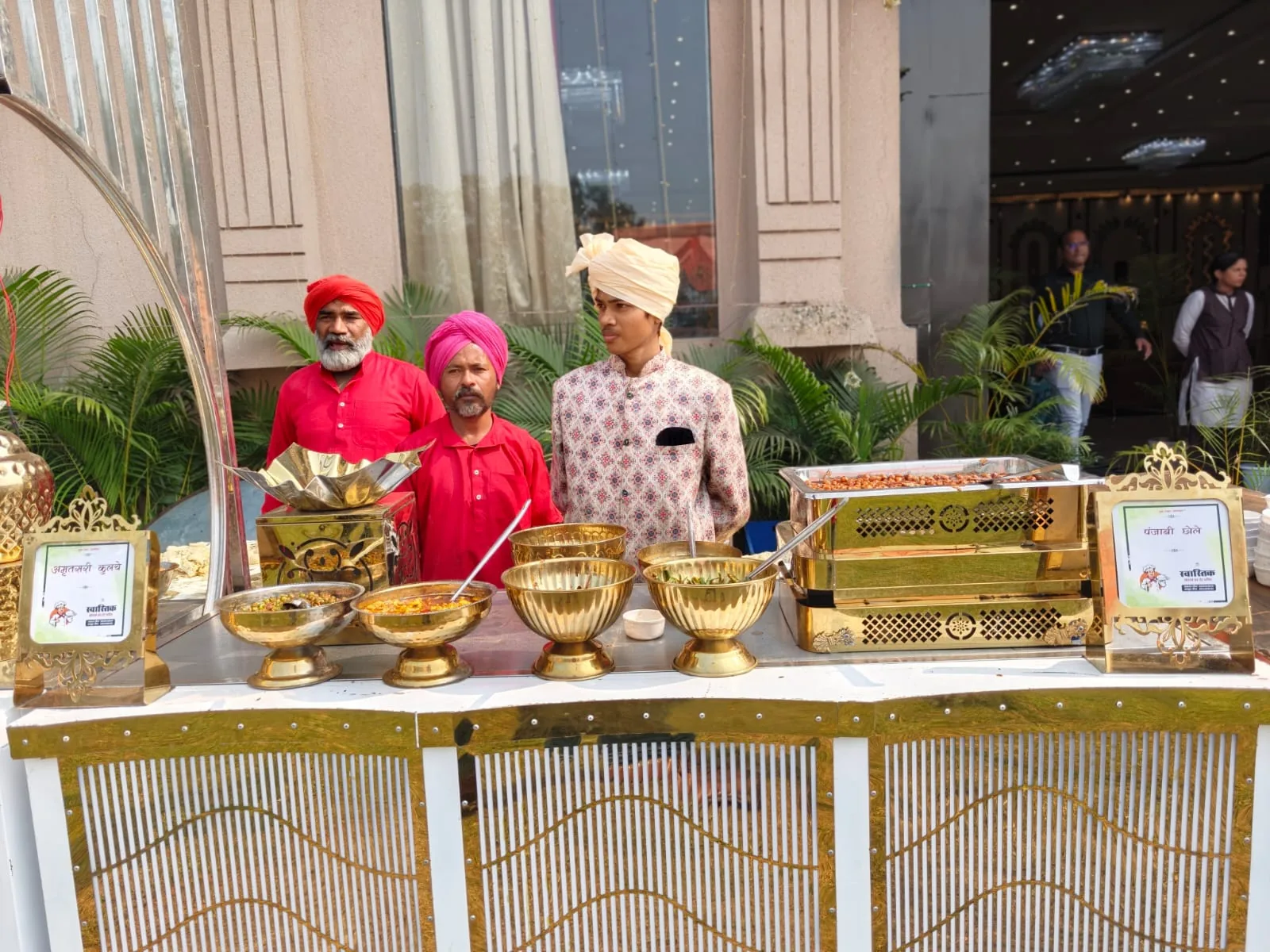 Swastik Caters team serving Indian snacks at a live counter